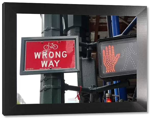 Red don t walk street sign and wrong way sign, New York City, New York, USA