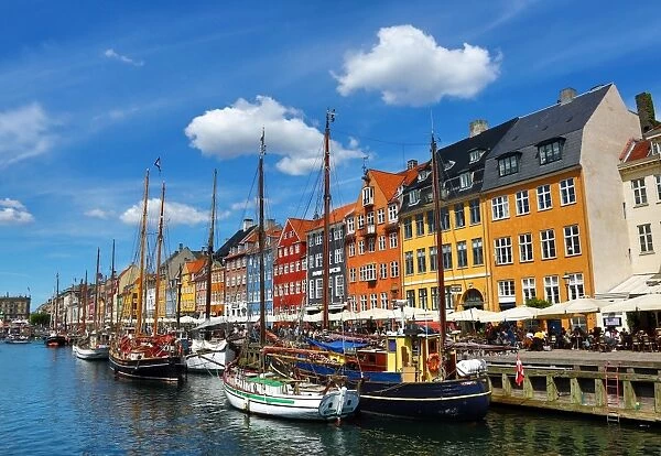 Coloured houses and boats at Nyhavn Quay in Copenhagen, Denmark