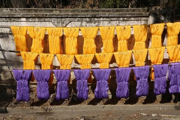 Dyeing and drying coloured yarn for the weaving industry in Amarapura, Mandalay, Myanmar