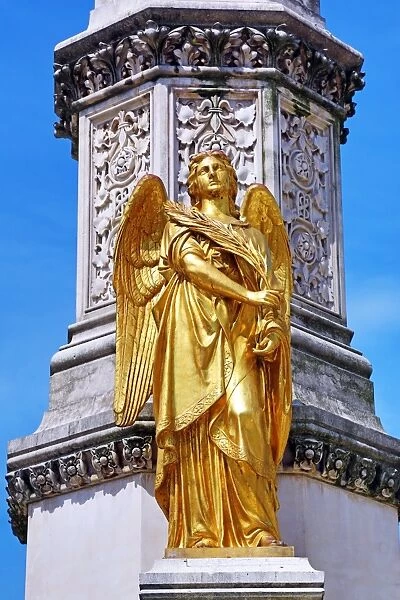 Gold angel statue on the column beside Zagreb Cathedral in Zagreb, Croatia
