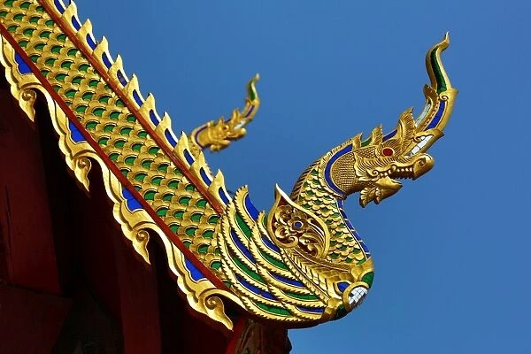 Gold roof decorations at Wat Sum Pow Temple in Chiang Mai, Thailand