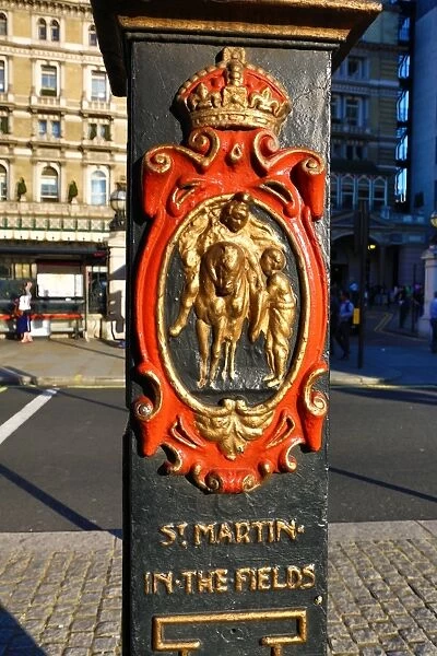 St Martins in the Fields crest on a lamppost at Charing Cross, London, England