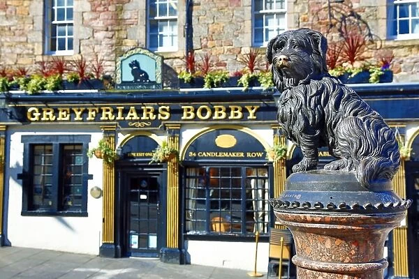 Statue of the loyal Skye Terrier dog Greyfriars Bobby and pub of the same name in Edinburgh