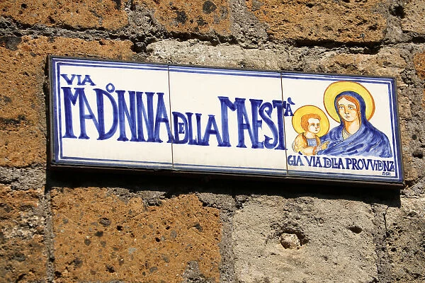 Street sign for the Via Madonna della Maesta in the hilltop village of Civita di Bagnoregio