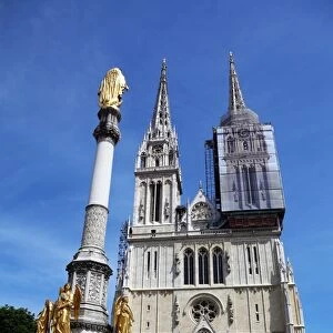 Zagreb Cathedral with tower renovation and Holy Mary Monument column in Zagreb, Croatia