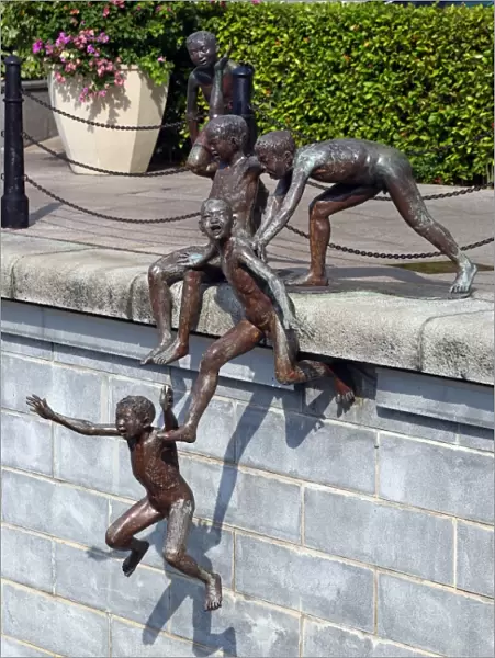People of the River statue by Chong Fah Cheong of children jumping into the river in Singapore, Republic of Singapore