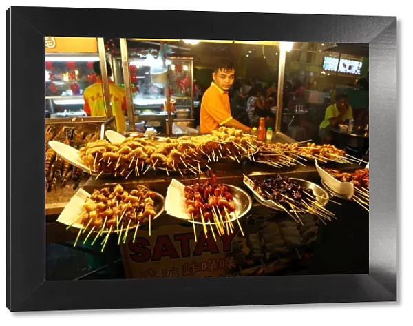 Satay stall with street food in Jalan Alor in Bukit Bintang in Kuala Lumpur, Malaysia