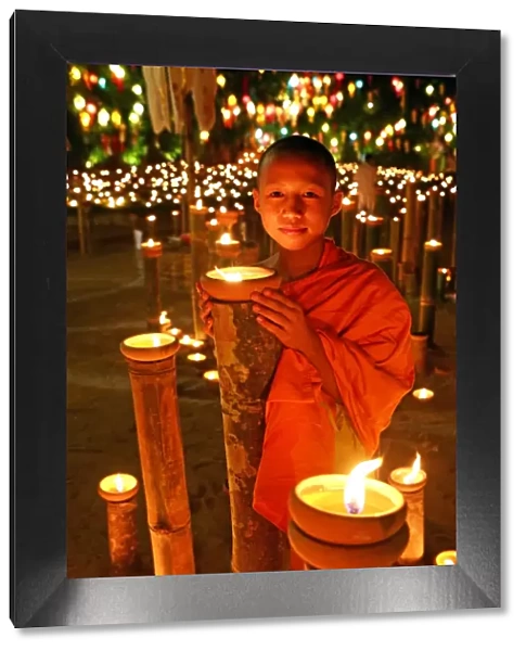 Buddhist Monk with candles, Loy Krathong, Chiang Mai, Thailand