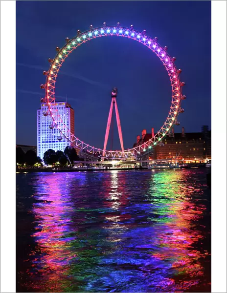 Rainbow coloured London Millennium Eye illuminated for Gay Pride