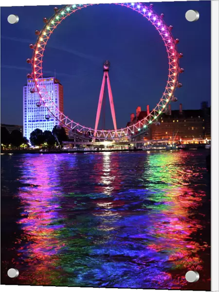 Rainbow coloured London Millennium Eye illuminated for Gay Pride