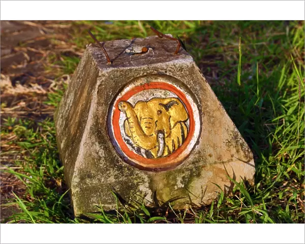 Gold elephant on road marker stone, Vientiane, Laos