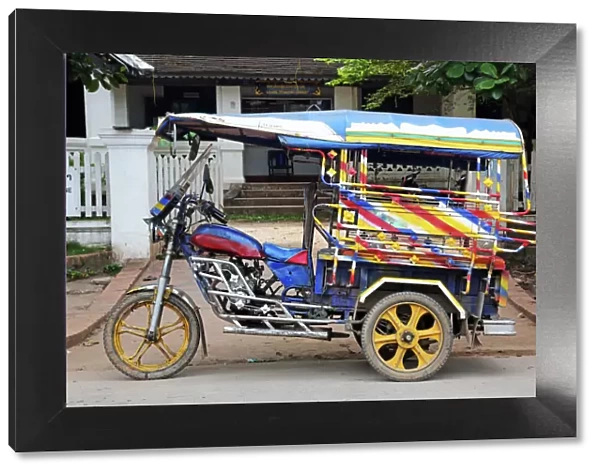 Three wheeled Tuk Tuk taxi in Luang Prabang, Laos