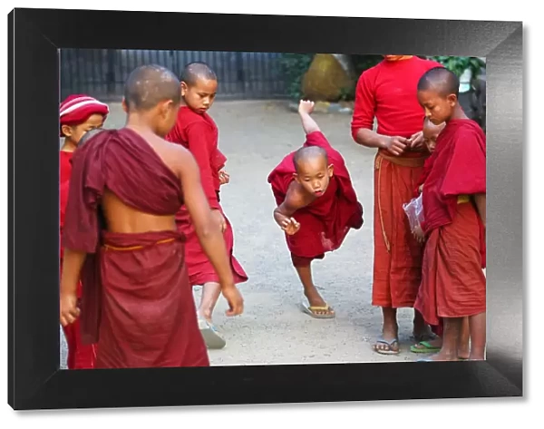 Young Buddhist monks playing at a temple in Amarapura, Mandalay, Myanmar (Burma)