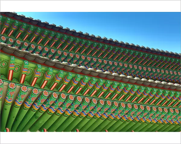 Green wooden roof beams of the Gwanghwamun Gate at Gyeongbokgung Palace in Seoul, Korea
