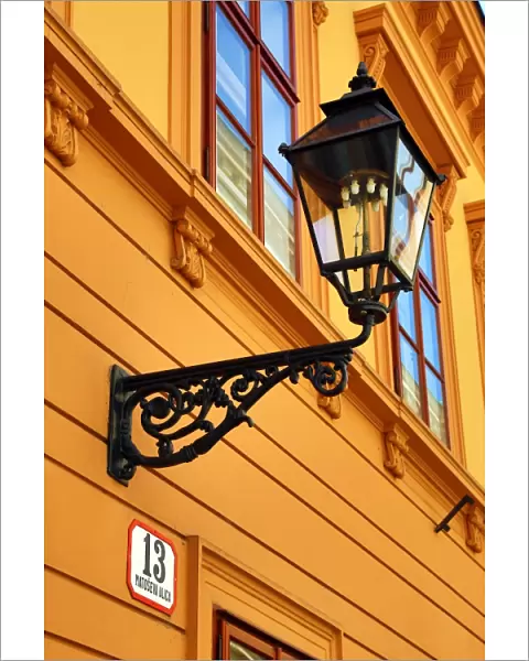 Metal street lamp on a building in Matoseva Ulica in Zagreb, Croatia