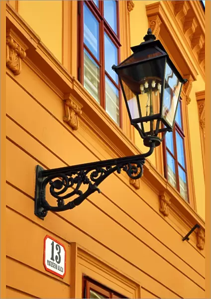 Metal street lamp on a building in Matoseva Ulica in Zagreb, Croatia