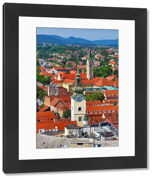 Aerial view of rooftops and the towers of St Marys Church and St Francis Church in Zagreb