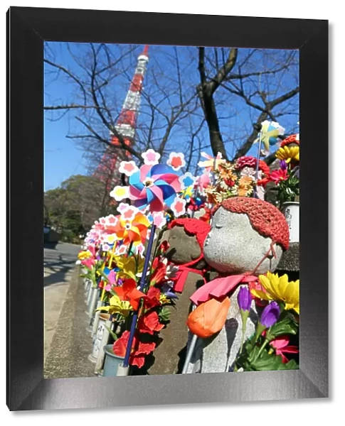 Jizo statues and pinwheel windmill toys in the Zojoji Temple cemetery garden