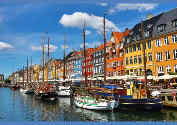 Boats and colourful houses at Nyhavn Quay in Copenhagen, Denmark