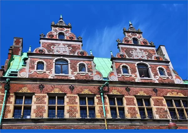 Traditional architecture of the Royal Copenhagen shop building roof in Stroget in Copenhagen