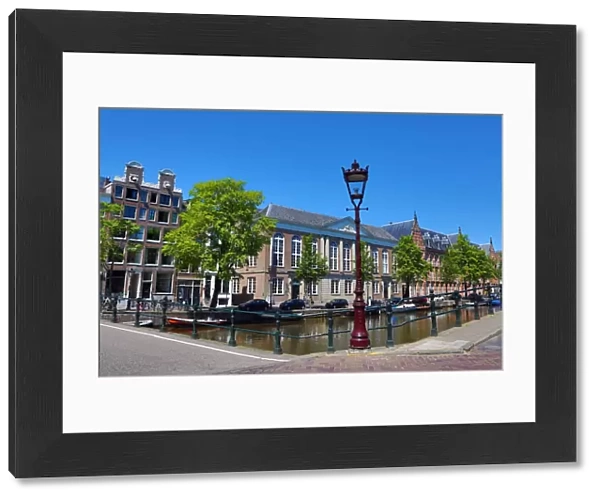 Street scene with lamppost and canal in Amsterdam, Holland