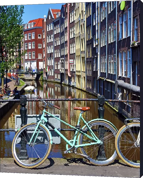 Bicycles on bridge on Oudezijds Achterburgwal canal, Amsterdam