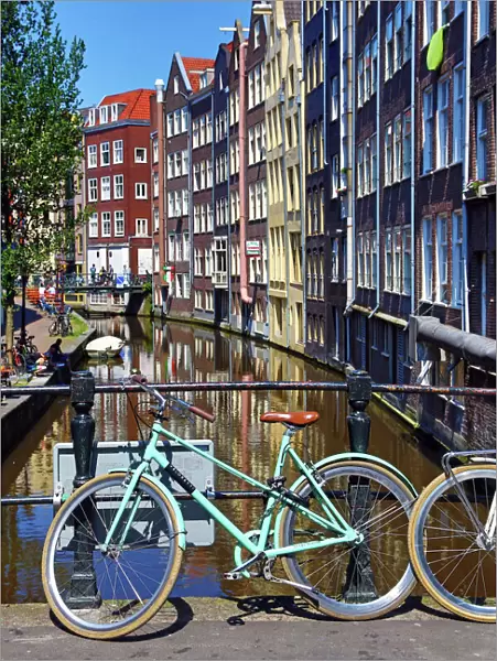 Bicycles on bridge on Oudezijds Achterburgwal canal, Amsterdam