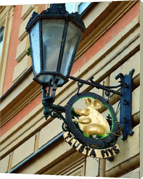 Street lamp and golden mouse sign for the Tlusta Mys (Fat Mouse), Prague, Czech Republic