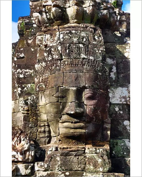 Stone face in the ruins of the Bayon Khmer Temple, Angkor Thom, Siem Reap, Cambodia