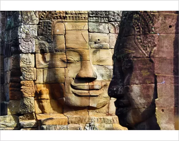 Stone face in the ruins of the Bayon Khmer Temple, Angkor Thom, Siem Reap, Cambodia