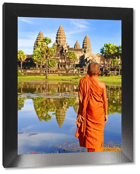Angkor Wat Temple with young Buddhist Monk, Siem Reap, Cambodia