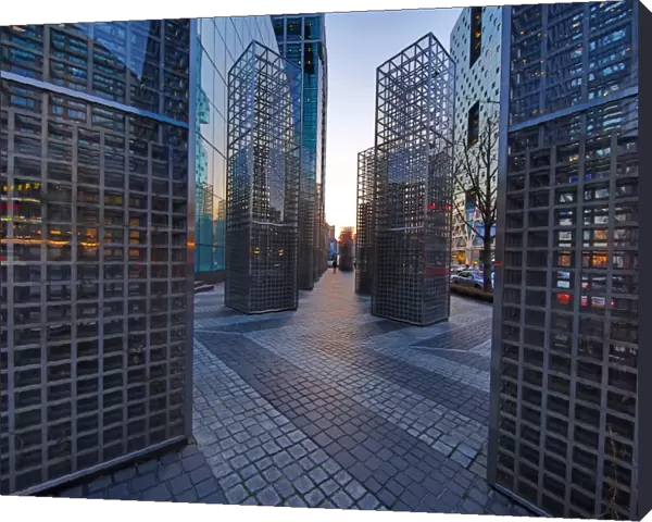 Metal structures beside the office blocks at dusk in the Gangnam district, Seoul, Korea