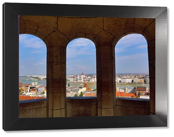 City skyline seen through a window of the Fishermans Bastion in Budapest, Hungary