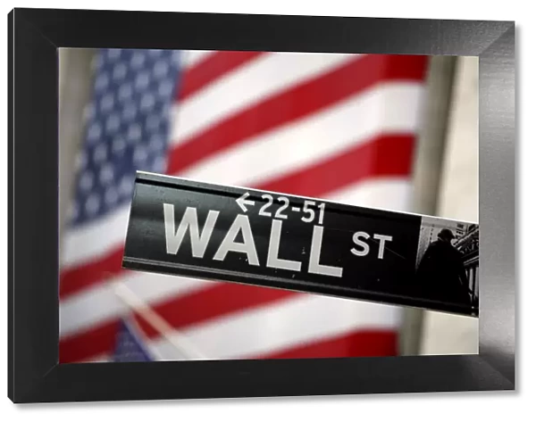 Wall Street sign and American Flag in New York, USA