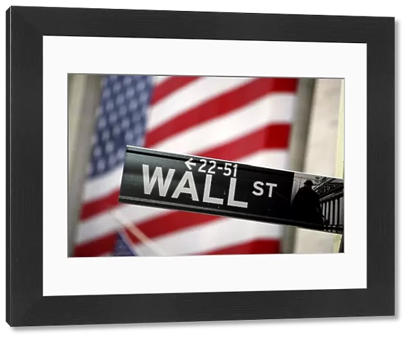 Wall Street sign and American Flag in New York, USA