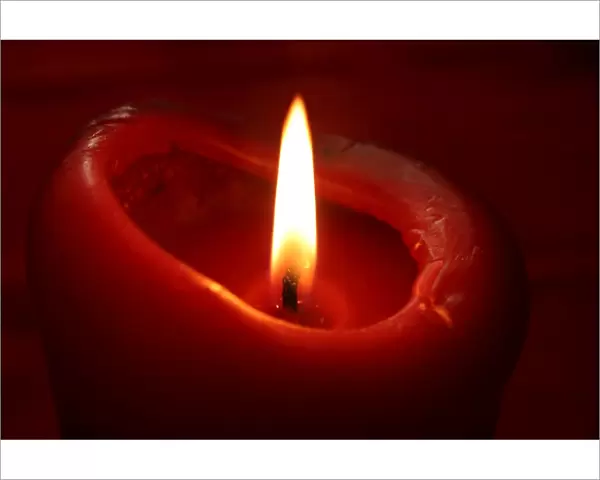 Red candle and flame