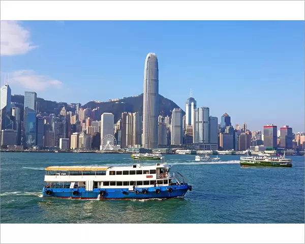 The city skyline of the Central area of Hong Kong and ferries in Victoria Harbour in Hong Kong