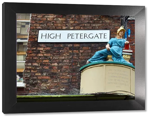 High Petergate street sign and statue in York, Yorkshire, England