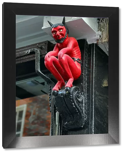 Little Red Devil statue, symbol of a printer, in York, Yorkshire, England