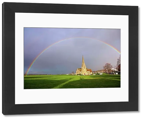 Seasonal weather - Rainbow over All Saints Church, Blackheath, London, UK