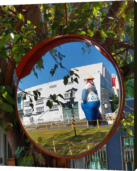 Statue at the Pier 2 Art Center in a mirror, Kaohsiung City, Taiwan