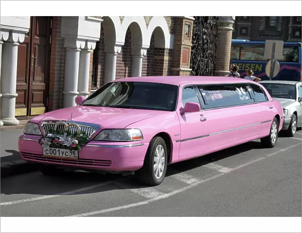 Pink stretch limousine car in St. Petersburg, Russia
