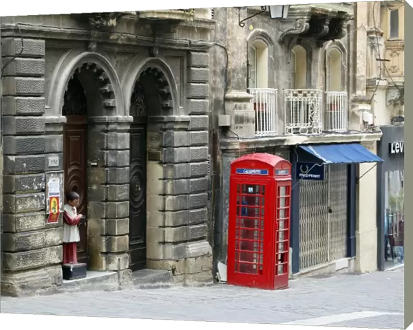 Red English telephone box in Valletta, Malta