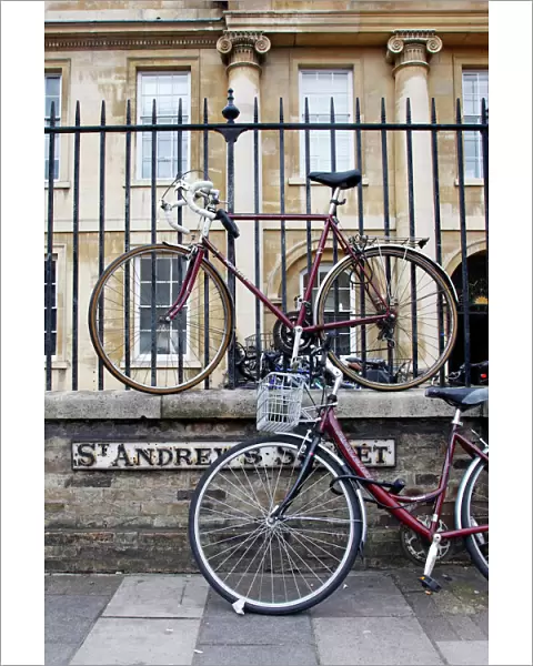 Bicycles attached to railings in Cambridge