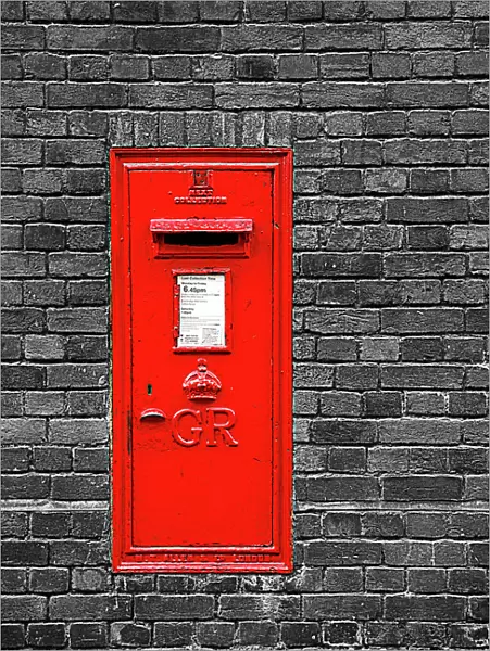 Red English Post Box in a brick wall