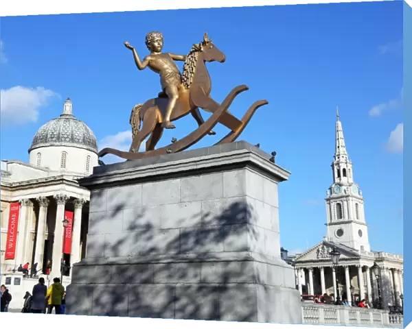 Boy on a rocking horse statue in Trafalgar Square in London