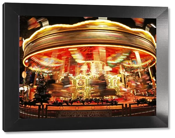 Motion blur view of a Merry go round carousel in London