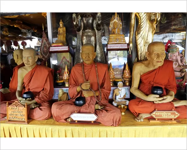 Wax statues of monks at Pattaya Floating Market in Pattaya, Thailand