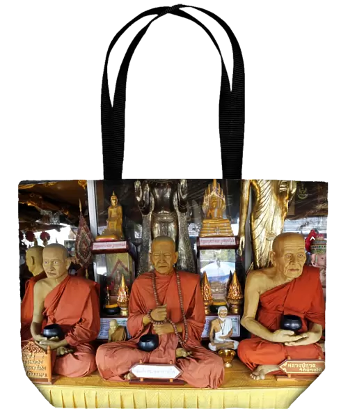Wax statues of monks at Pattaya Floating Market in Pattaya, Thailand