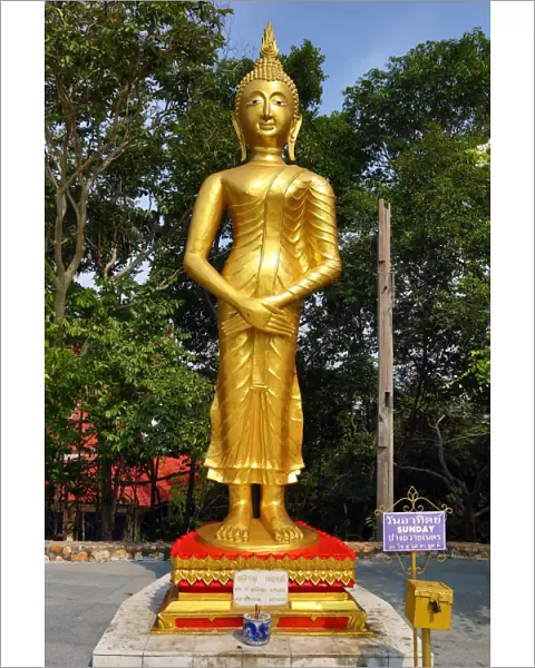 Gold Buddha statue at Wat Khao Phra Bat in Pattaya, Thailand